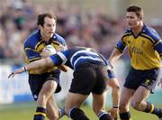 8 January 2005; Girvan Dempsey, Leinster, supported by team-mate David Holwell, is tackled by Michael Lipman, Bath. Heineken European Cup 2004-2005, Round 5, Pool 2, Bath v Leinster, The Recreation Ground, Bath, England. Picture credit; Damien Eagers / SPORTSFILE