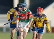 8 January 2005; Adrian Freeman, Mayo, in action against Mervyn Connaughton, left, and Damien Kenny, right, Roscommon.  Knock airport.com Hurling League, Roscommon v Mayo, Mulherrin Park, Feurity, Co. Roscommon. Picture credit; Pat Murphy / SPORTSFILE