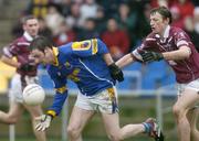 9 January 2005; Kevin Mulligan, Longford, in action against Colin Galligan, Westmeath. O'Byrne Cup, Quarter-Final, Longford v Westmeath, Pearse Park, Longford. Picture credit; David Maher / SPORTSFILE
