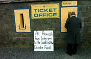 9 January 2005; A GAA supporter purchases his ticket with all the proceeds going to the Asian Disater Fund.  O'Byrne Cup, Quarter-Final, Longford v Westmeath, Pearse Park, Longford. Picture credit; David Maher / SPORTSFILE