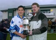 9 January 2005; Jason Sherlock, Dublin Blue Stars, is presented with the cup by Chairman of the Dublin County Board John Bailey. Dublin Footballers v Dublin Blue Star Footballers, Naomh Barrog, Kilbarrick, Dublin. Picture credit; Brian Lawless / SPORTSFILE