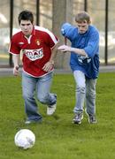 10 January 2005; Robbie Doyle, St. Patrick's Athletic, in action against Darren Connelly, a Client of Merchants Quay, during a photocall to announce details of an Allstars Charity Match between St. Patrick's Athletic, including members of the cast of Fair City, and Merchants Quay Ireland. The match will take place in Richmond Park on Sunday 16th January and all proceeds will be going to GOAL's Tsunami Appeal. RTE Studios, Dublin. Picture credit; David Maher / SPORTSFILE
