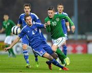 15 November 2013; Seán Murray, Republic of Ireland, in action against Pál Joensen, Faroe Islands. UEFA U21 Qualifying Round, Group 6, Republic of Ireland v Faroe Islands, Showgrounds, Sligo. Picture credit: Barry Cregg / SPORTSFILE