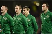 15 November 2013; The Republic of Ireland team showed their support for the White Ribbon campaign at tonight’s friendly international against Latvia at the Aviva stadium, by wearing white ribbons on their jackets during the National Anthem. White Ribbon is Ireland’s only national, male-led primary prevention campaign to end men’s violence against women. It is promoted in Ireland by the Men’s Development Network, a non-profit organisation. White Ribbon Day, on Monday, November 25th, focuses on men ending violence towards women. Three International Friendly, Republic of Ireland v Latvia, Aviva Stadium, Lansdowne Road, Dublin. Photo by Sportsfile