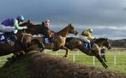 29 December 2004; Strong Project,7, with Paul Carberry up, jumps the first on their way to winning the Coyle Hamilton Willis Beginners Steeplechase also pictured are Skibb with Conor O'Dwyer and In To The Sunset,4, with David Russell. Leopardstown Racecourse, Dublin. Picture credit; Matt Browne / SPORTSFILE