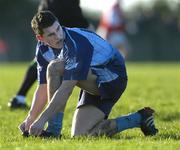 8 January 2005; Bernard Brogan, Dublin, adjusts his boots during the game. O'Byrne Cup, Quarter-Final, Louth v Dublin, O'Rahilly Park, Drogheda, Co. Louth. Picture credit; Ray McManus / SPORTSFILE