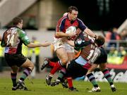 15 January 2005; Rob Henderson, Munster, in action against Simon Keogh (14) and Andy Dunne (10), NEC Harlequins. Heineken European Cup 2004-2005, Round 6, Pool 4, NEC Harlequins v Munster, Twickenham, England. Picture credit; Brendan Moran / SPORTSFILE