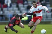 16 January 2005; Sean Martin Lockart , Derry, in action against Liam Doyle, Down. McKenna Cup, Down v Derry, Pairc an Iuir, Newry, Co. Down. Picture credit; David Maher / SPORTSFILE