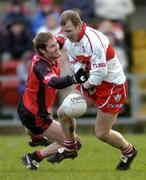 16 January 2005; Johnny McBride, Derry, in action against Alan Molloy, Down. McKenna Cup, Down v Derry, Pairc an Iuir, Newry, Co. Down. Picture credit; David Maher / SPORTSFILE