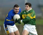 16 January 2005; Fergal O'Callaghan, Tipperary, is tackled by Dan Doona, Kerry. McGrath Cup, Tipperary v Kerry, Clonmel sports field, Clonmel, Co. Tipperary. Picture credit; Ray McManus / SPORTSFILE