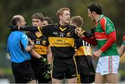 16 November 2013; Colm Cooper, Dr. Crokes, and Micheal Webster, Loughmore-Castleiney, confront one another while referee Michael Collins speaks to Chris Brady before showing him a red card. AIB Munster Senior Club Football Championship, Semi-Final, Dr. Crokes v Loughmore-Castleiney, Dr. Crokes GAA Club, Killarney, Co. Kerry. Picture credit: Diarmuid Greene / SPORTSFILE