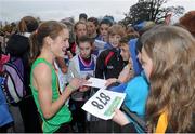 17 November 2013; Fionnuala Britton, Kilcoole A.C, Co. Wicklow, signs autographs for fans after the 2013 Woodie’s DIY Inter County & Juvenile Even Age Cross Country Championships of Ireland. Santry Demesne, Santry, Co. Dublin. Picture credit: Ramsey Cardy / SPORTSFILE