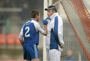 17 November 2013; Ryan Scott, Ballinderry Shamrocks, exchanges words with the umpire after being sent off by referee Martin Higgins. AIB Ulster Senior Club Football Championship, Semi-Final, Ballinderry Shamrocks, Derry v Kilcoo Owen Roes, Down. Athletic Grounds, Armagh. Photo by Sportsfile