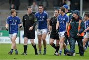 17 November 2013; Cratloe players, from left, Podge Collins, Conor Ryan and Cathal McInerney speak with referee Derek O'Mahony, right, and linesman Sean Lonergan after the game. AIB Munster Senior Club Football Championship, Semi-Final, Cratloe, Clare v Ballinacourty, Waterford. Cusack Park, Ennis, Co. Clare. Picture credit: Diarmuid Greene / SPORTSFILE