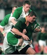 28 November 1998; Adrian Garvy, South Africa, is tackled by Ireland's Malcolm O'Kelly and Keith Wood, bottom. International Rugby Friendly, Ireland v South Africa, Landsdowne Road, Dublin. Picture credit: Matt Browne / SPORTSFILE
