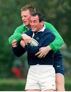 27 October 1998: Ireland's Eric Elwood is tackled by team-mate Malcolm O'Kelly, behind, during squad training. Ireland Rugby Squad Training, King's Hospital Rugby Ground, Dublin. Picture credit: Matt Browne / SPORTSFILE
