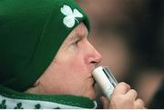 28 November 1998; An Ireland rugby supporter watches the game. International Rugby Friendly, Ireland v South Africa, Landsdowne Road, Dublin. Picture credit: Brendan Moran / SPORTSFILE