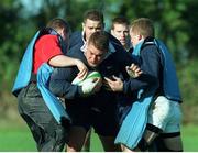 26 October 1998; Ireland's Justin Fitzpatrick is tackled by team-mates Conor McGuinness, left, Andy Ward, back centre, and Pat Duignan, right, during squad training. Ireland Rugby Squad Training, Westmanstown Sports Centre, Dublin. Picture credit: Matt Browne / SPORTSFILE