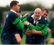 18 November 1998: Ireland's Keith Wood is tackled by team-mates Andy Ward, left, and Jeremy Davidson, right, during squad training. Ireland Rugby Squad Training, Greystones RFC, Greystones, Co. Wicklow. Picture credit: Matt Browne / SPORTSFILE