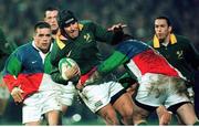 24 November 1998; Braam Van Straaten, South Africa, is tackled by Allen Clarke, left, and Anthony Foley, Combined Provinces. Rugby fiendly, Combined Provinces v South Africa, Musgrave Park, Cork. Picture credit: Matt Browne / SPORTSFILE