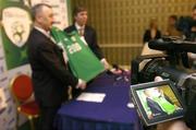 19 January 2005; John Courtenay, left, Managing Director of Umbro Ireland, with John Delaney, interim FAI Chief Executive Officer, pictured through the viewfinder of a video camera at the announcement by the FAI of a major sponsorship agreement with Umbro valued at a minimum 10 million euro over the next six years. Berkley Court Hotel, Dublin. Picture credit; David Maher / SPORTSFILE
