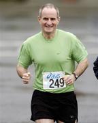 19 January 2005; Dr. Martin McAleese in action during a 5K Fun Run / Walk, organised by Sergeant Kevin Grogan of Ballyfermot Garda Station, in aid of the Asian Tsunami Disaster. Phoenix Park, Dublin. Picture credit; Brian Lawless / SPORTSFILE