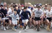 19 January 2005; Participants in a 5K Fun Run / Walk, organised by Sergeant Kevin Grogan of Ballyfermot Garda Station, in aid of the Asian Tsunami Disaster, get the run underway outside Garda Headquarters, Phoenix Park, Dublin. Picture credit; Brian Lawless / SPORTSFILE