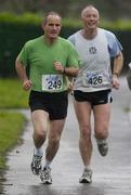 19 January 2005; Dr. Martin McAleese, left, in action alongside Sergeant Morgan Martin during a 5K Fun Run / Walk, organised by Sergeant Kevin Grogan of Ballyfermot Garda Station, in aid of the Asian Tsunami Disaster. Phoenix Park, Dublin. Picture credit; Brian Lawless / SPORTSFILE