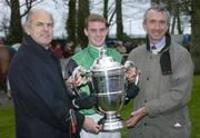 20 January 2005; Owner, Bernard Carroll, left, pictured with jockey Niall Madden and trainer Martin Brassil, right, after winning the Goulding Thyestes Handicap Steeplechase. Gowran Park, Co. Kilkenny. Picture credit; Matt Browne / SPORTSFILE