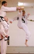 20 January 2005; The Republic of Ireland Taekwon-Do Association are host to the All Europe Taekwon-Do Federation 11th Junior and 20th Senior Black Belt European Taekwon-Do Championships in the National Basketball Arena, Tallaght, Dublin from the 8th-10th Arpil 2005. Demonstrating one of the techniques is Gavin Coker breaking some wood held by Richard Barber, assisted by Mark Pollack. Republic of Ireland Taekwon-Do Association, Parnell Street, Dublin. Picture credit; Brendan Moran / SPORTSFILE