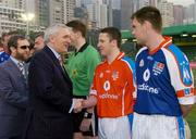 22 January 2005; An Taoiseach Bertie Ahern,T.D., is introduced to Declan Browne, Tipperary, before the start of the game. Exhibition Game, 2003 Vodafone All-Stars v 2004 Vodafone All-Stars, Hong Kong Football Club, Hong Kong, China. Picture credit; Ray McManus / SPORTSFILE