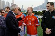 22 January 2005; An Taoiseach Bertie Ahern,T.D., is introduced to Peter Canavan, Tyrone, before the start of the game. Exhibition Game, 2003 Vodafone All-Stars v 2004 Vodafone All-Stars, Hong Kong Football Club, Hong Kong, China. Picture credit; Ray McManus / SPORTSFILE