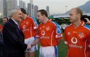 22 January 2005; An Taoiseach Bertie Ahern,T.D., is introduced to Adrian Sweeney, Donegal, before the start of the game. Exhibition Game, 2003 Vodafone All-Stars v 2004 Vodafone All-Stars, Hong Kong Football Club, Hong Kong, China. Picture credit; Ray McManus / SPORTSFILE