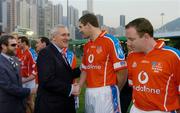 22 January 2005; An Taoiseach Bertie Ahern,T.D., is introduced to Kevin Walsh, Galway, before the start of the game. Exhibition Game, 2003 Vodafone All-Stars v 2004 Vodafone All-Stars, Hong Kong Football Club, Hong Kong, China. Picture credit; Ray McManus / SPORTSFILE