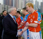 22 January 2005; An Taoiseach Bertie Ahern,T.D., is introduced to Padraig Clancy, Laois, before the start of the game. Exhibition Game, 2003 Vodafone All-Stars v 2004 Vodafone All-Stars, Hong Kong Football Club, Hong Kong, China. Picture credit; Ray McManus / SPORTSFILE