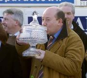 23 January 2005; James McMahon, a member of the winning syndicate, kisses the trophy after winning the AIG Europe Champion Hurdle. Leopardstown Racecourse, Dublin. Picture credit; Matt Browne / SPORTSFILE