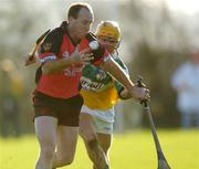 23 January 2005; Gary Savage, Down, in action against Ger Oakley, Offaly. Walsh Cup, Offaly v Down, Carrig and Riverstown GAA Club, Carrig, Co. Tipperary. Picture credit; Damien Eagers / SPORTSFILE