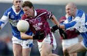 23 January 2005; Colin Galligan, Westmeath, in action against Mark Dunne, left, and Paul McDonald, Laois. O'Byrne Cup Final, Westmeath v Laois, Cusack Park, Mullingar, Co. Westmeath. Picture credit; David Maher / SPORTSFILE