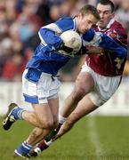 23 January 2005; Ross Munnelly, Laois, in action against Michael Ennis, Westmeath. O'Byrne Cup Final, Westmeath v Laois, Cusack Park, Mullingar, Co. Westmeath. Picture credit; David Maher / SPORTSFILE