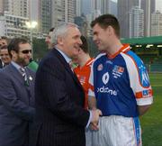 22 January 2005; An Taoiseach Bertie Ahern,T.D., is introduced to Fergal Byron, Laois, before the start of the game. Exhibition Game, 2003 Vodafone All-Stars v 2004 Vodafone All-Stars, Hong Kong Football Club, Hong Kong, China. Picture credit; Ray McManus / SPORTSFILE