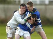 24 January 2005; Malahide CS goalkeeper Kevin Ryan celebrates with team-mates Barry Ryan, (centre) and Andy Grey, right, after victory over St Declan's CBS. Dublin Schools Senior Football A Final, St. Declan's CBS v Malahide CS, St. Claire's DCU, Dublin. Picture credit; Damien Eagers / SPORTSFILE