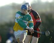 23 January 2005; Brian Carroll, Offaly, in action against Gabriel Clarke, Down. Walsh Cup, Offaly v Down, Carrig and Riverstown GAA Club, Carrig, Co. Tipperary. Picture credit; Damien Eagers / SPORTSFILE