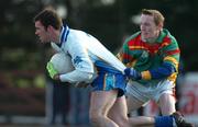 26 January 2005; Damien Burke, DIT, in action against Peter O'Leary, Carlow IT. Datapac Sigerson Cup, Preliminary Round, DIT v Carlow IT, Ballymun Kickhams, Dublin. Picture credit; Pat Murphy / SPORTSFILE