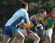 26 January 2005; Peter O'Leary, Carlow IT, in action against Damien Burke, DIT. Datapac Sigerson Cup, Preliminary Round, DIT v Carlow IT, Ballymun Kickhams, Dublin. Picture credit; Pat Murphy / SPORTSFILE