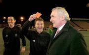 26 January 2005; Referee Pat Kelly, centre, shows the red card to An Taoiseach Bertie Ahern, T.D., before the start of the game. Charity Match, FAI / Media team  v Oireachtas team, Dalymount Park, Dublin. Picture credit; David Maher / SPORTSFILE