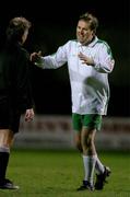 26 January 2005; Tom Kitt, right, Government Chief Whip, Oireachtas team, shares a smile with referee Pat Kelly during the game. Charity Match, FAI / Media team  v Oireachtas team, Dalymount Park, Dublin. Picture credit; David Maher / SPORTSFILE