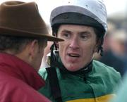 27 January 2005; Jockey Tony McCoy in conversation with Frank Berry, racing manager to JP McManus, after winning the Durkan Anaglog's Daughter EBF Mares Novice Steeplechase on Adarma. Thurles Racecourse, Co. Tipperary. Picture credit; Matt Browne / SPORTSFILE