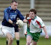 28 January 2005; Pat Kelly, Garda College, Templemore, in action against Conor McWilliams, UUC. Datapac Sigerson Cup, Preliminary Round, Garda College, Templemore v University of Ulster, Coleraine, County Grounds, Drogheda, Co. Louth. Picture credit; Damien Eagers / SPORTSFILE