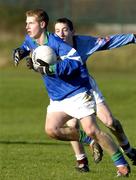 24 January 2005; Russell Cleere, Malahide CS, in action against Rory Corcoran, St Declan's CS. Dublin Schools Senior Football A Final, St. Declan's CBS v Malahide CS, St. Claire's DCU, Dublin. Picture credit; Damien Eagers / SPORTSFILE
