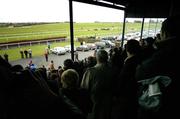 27 January 2005; Racing punters watch the first race from the main stand. Thurles Racecourse, Co. Tipperary. Picture credit; Matt Browne / SPORTSFILE